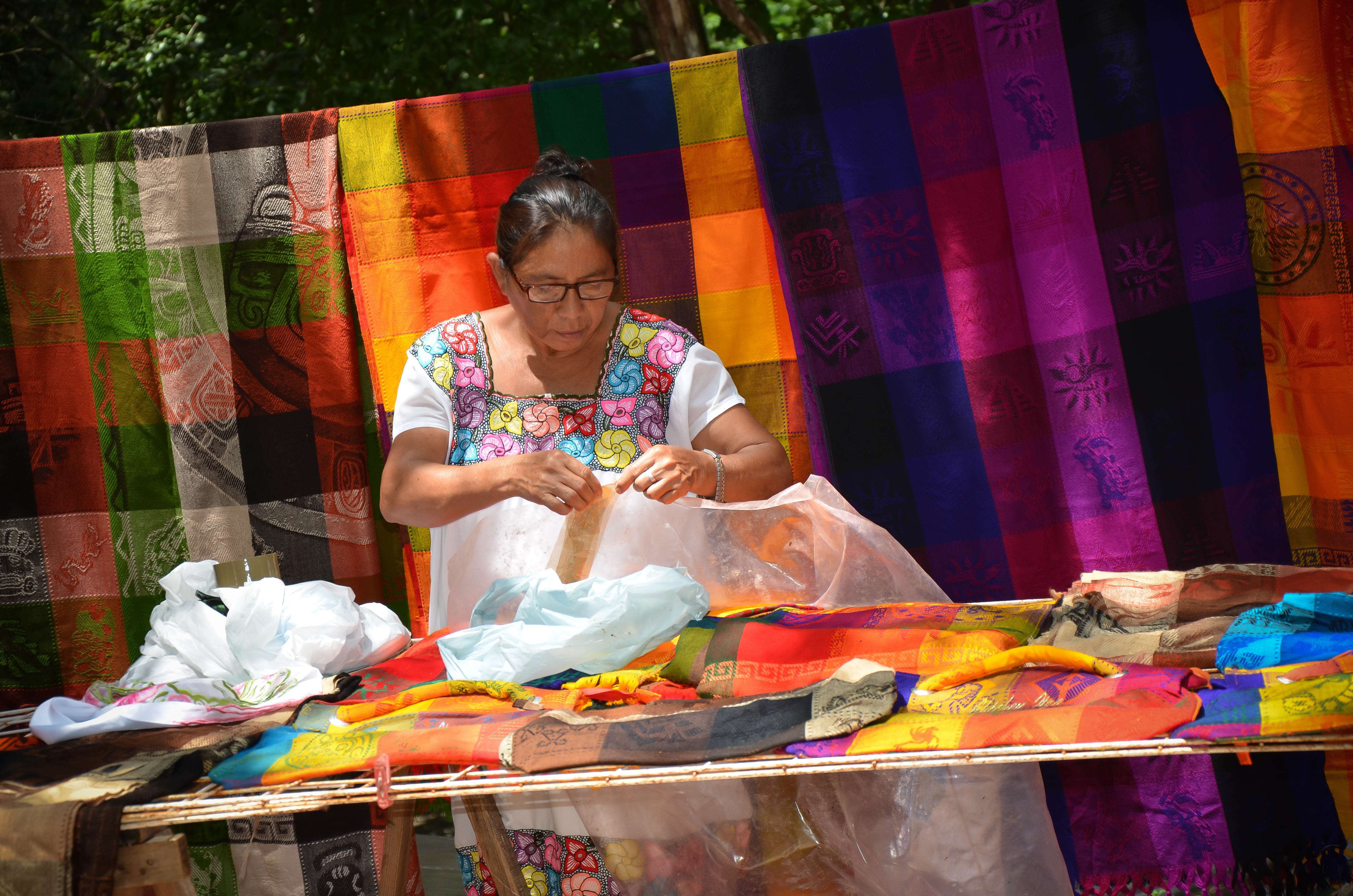Mexican artisan weaving colorful fabrics