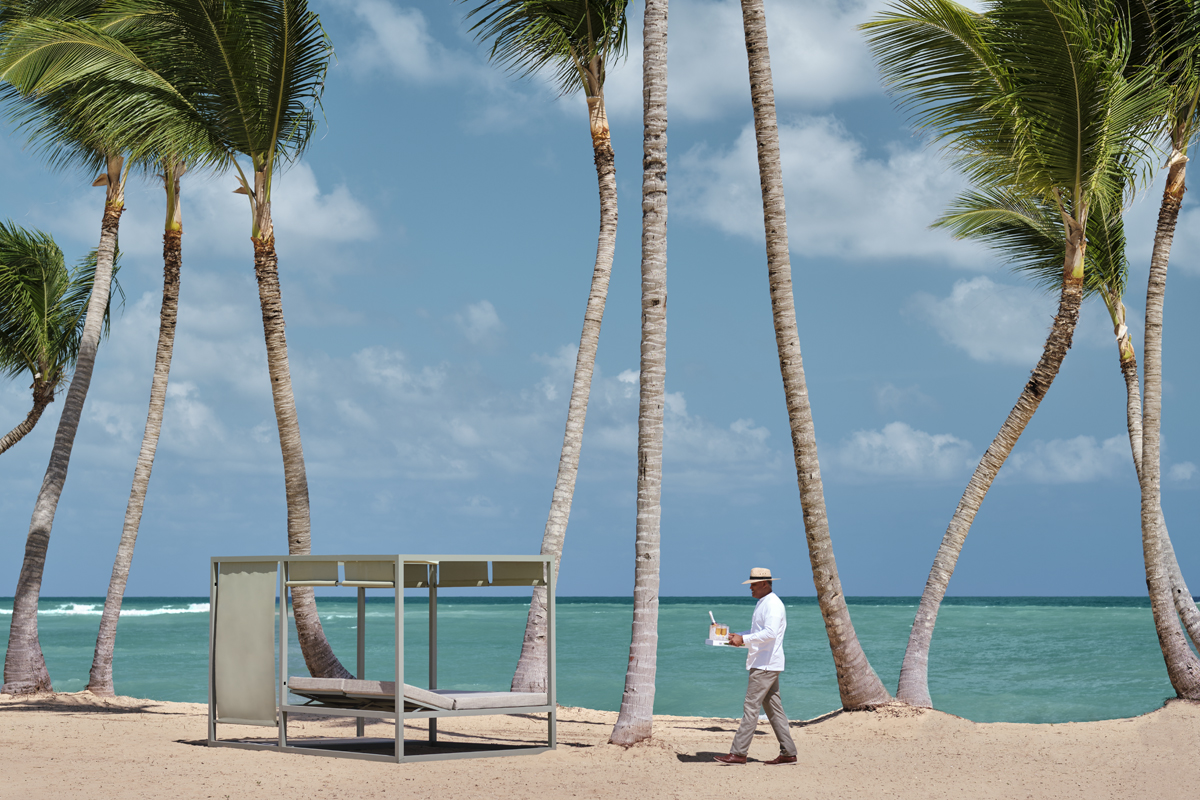 Blue waters of the Caribbean next to a beachfront resort
