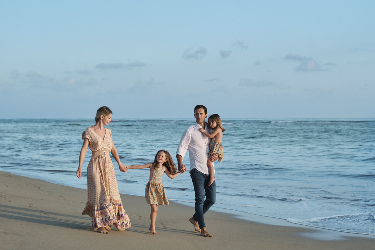 Family walking together along the beach