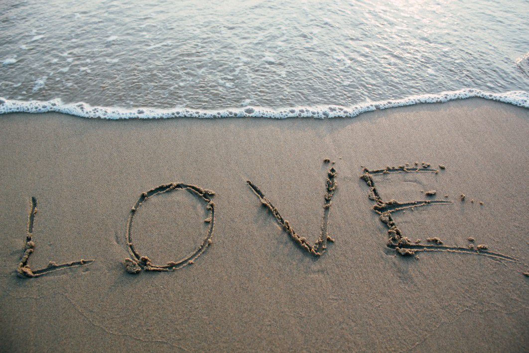 Writing in the sand on a Caribbean beach