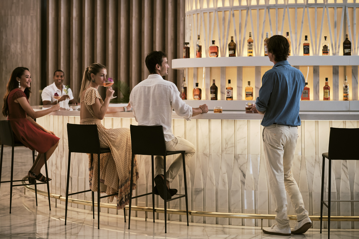 Adults enjoying rum in a bar in the Dominican Republic