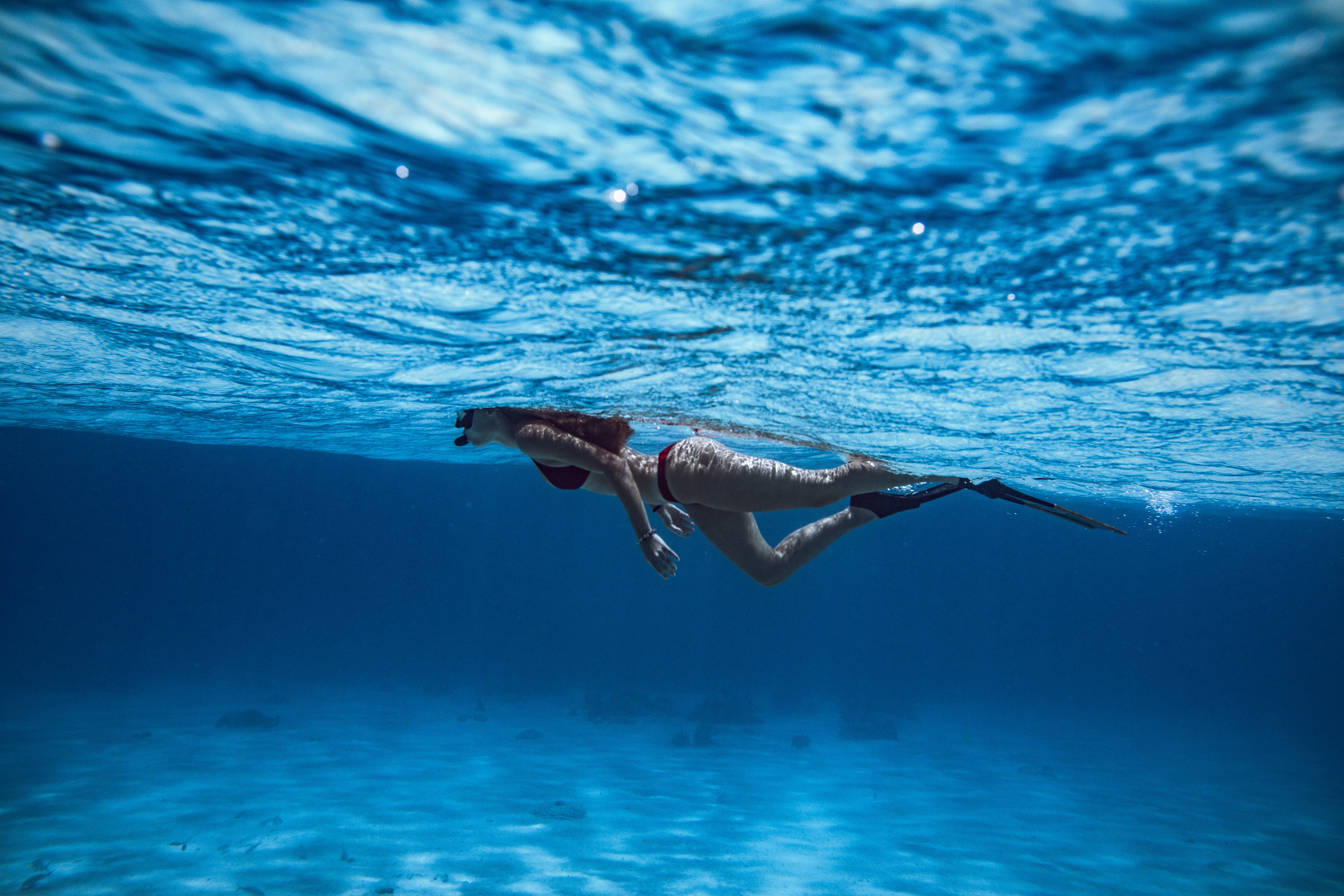 Woman snorkeling in the ocean as a fun ocean activity in the Caribbean